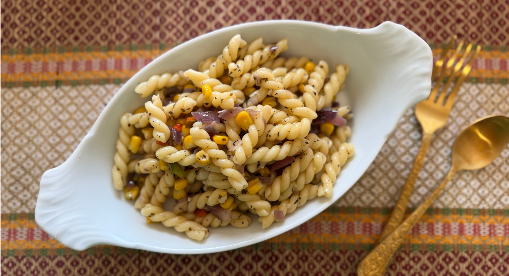 Image of butter garlic pasta with vegetables served in a bowl, a comforting pasta recipe and vegan pasta recipe for everyday meals.